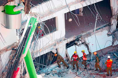 Derrumbe de edificio deja 2 muertos