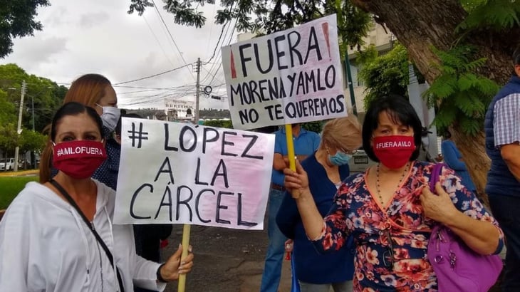 Protestan en Michoacán por visita de AMLO