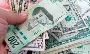 Dólar sube a 21.12 pesos en ventanillas