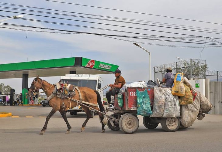 Sustituyen caballos por motos para recolectar basura en Tultepec