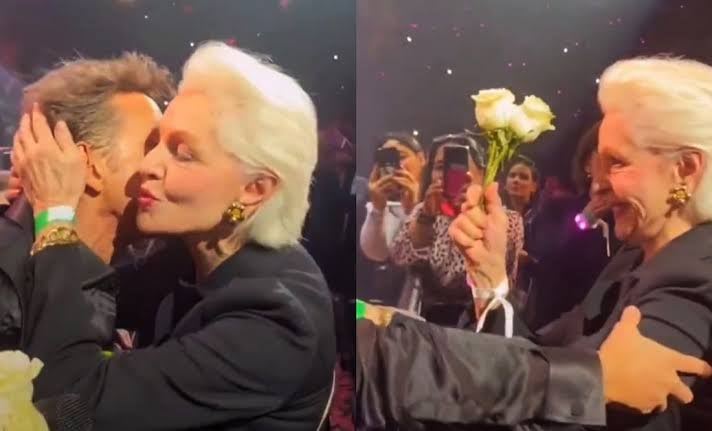 Carolina Herrera recibe flores y un beso de Luis Miguel