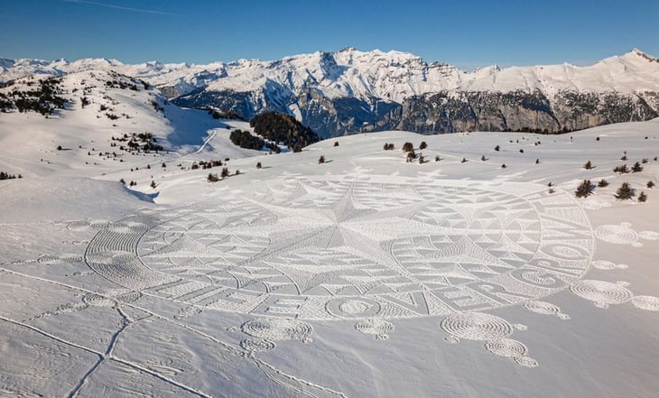 Con gigantesco dibujo en la nieve, Greenpeace protesta contra las ideas del Foro Económico de Davos
