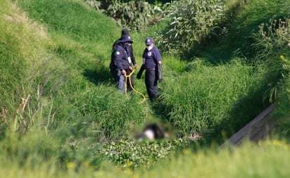 Hallan cuerpo de mujer flotando en río Lerma