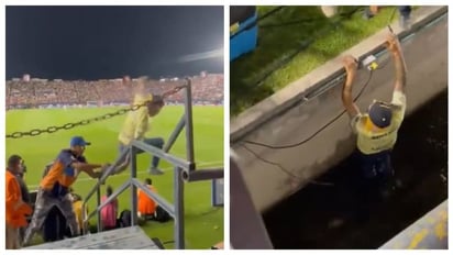 Aficionado del américa intenta invadir la cancha, termina mal, se cae en fosa y acaba empapado